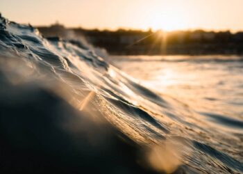 Wave's in the beach under the sunset